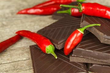 Dark chocolate and red chili peppers. Selling spicy chocolate. Crazy taste.