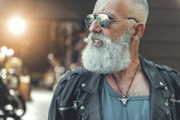 Assured aged biker in goggles