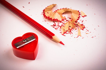 red sharpener and pencil