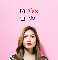 Yes No text with young woman on a pink background