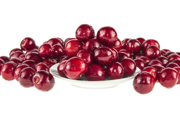 Many berries of fresh cherries on the white background