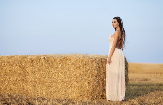 Bride posing in beautiful autumn landscape