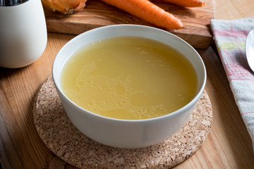 Bone broth made from chicken served in a plate