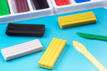 Obraz premium Colorful kid's plasticine on white background, Colorful dough modeling clay