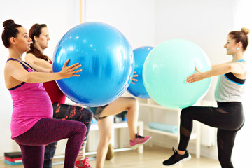 Fototapeta premium Group of pregnant women during fitness class