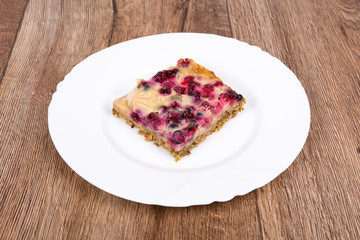 Vegetarian food on a plate with wooden background