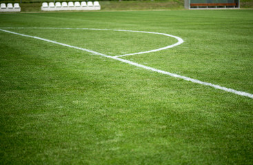 White line on a green football field