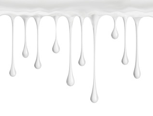 White cream or milk drops drip down, isolated on a white background