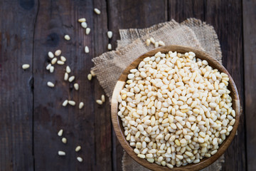 Shelled Raw Pine Nuts in the Wooden Bowl