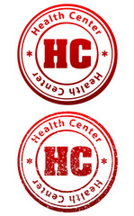 Pair of red rubber stamps in grunge and solid style with caption Health Center and abbreviation HC