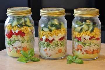 Fototapeta na wymiar Glass jars with salad ready to go