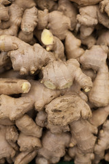 heap of ginger root Ginger background A bunch of ginger on the counter of a vegetable supermarket...