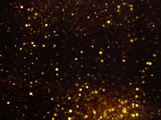 Golden overlay background of golden lights with bokeh effect.