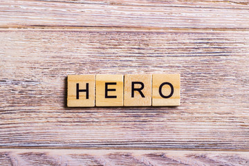 word hero written on cubes on wooden background