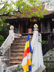 Holy Chinese shrine with ladder beside the Ho Chi Minh museum, Hanoi, Vietnam, with holy treasure flag