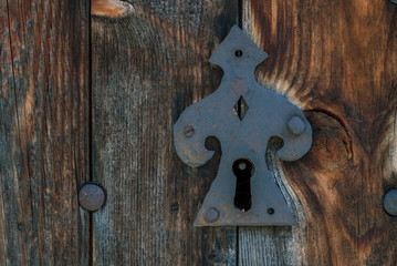 Old rusty metal lock and keyhole