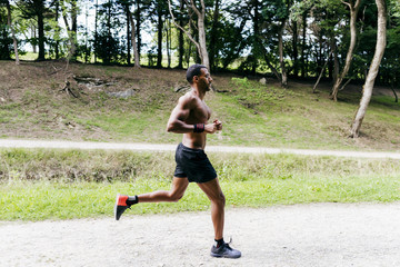 Black man running in park
