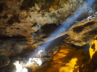 Sunlight shining through inside of Heaven cave in Ha long bay, Vietnam