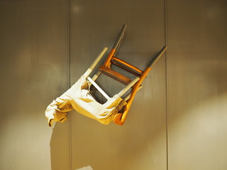Floating upside down chair on the wall