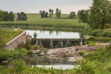 Fototapeta na wymiar Mound Lake Dam - A dam on a small lake.