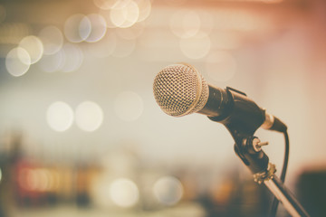 microphone and bokeh background, concept as music instrument in studio room and meeting hall