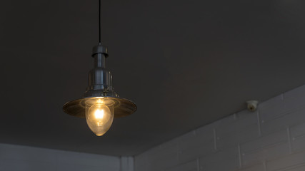 Incandescent lamps in a modern cafe.Hanging lamp,vintage