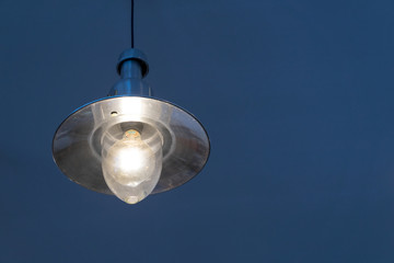 Incandescent lamps in a modern cafe.Hanging lamp,vintage