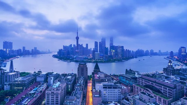 4K: China Shanghai at Dawn.Aerial view of high-rise buildings with Huangpu River in Shanghai, China.