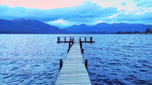 wooden pier on big lake in Te Anau, New Zealand.