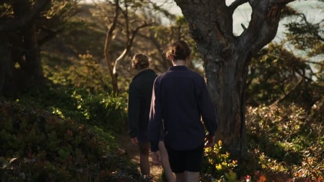Couple Walk Down Trail (Away From Camera) Toward Pacific Ocean On Oregon Coast, Slow Motion