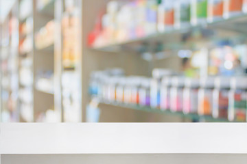 pharmacy store counter table top with blur medicine on shelves