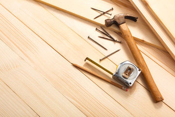 carpentry tools on wooden background, top view. Empty space for Your text