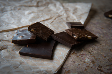 Dark chocolate stack with hazelnuts. Sweet dessert
