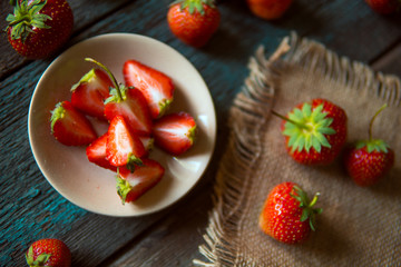 Strawberry on a wooden board in rustic style