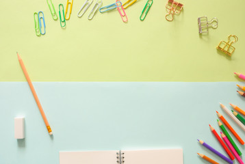 Minimal work space - Creative flat lay photo of workspace desk with sketchbook and wooden pencil on copy space green and blue pastel background. Top view , flat lay photography.