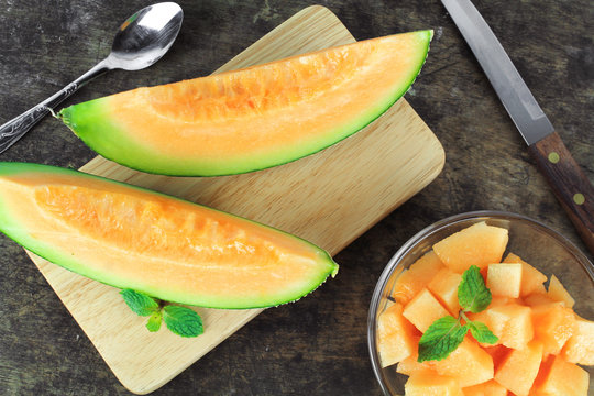 Fresh yellow melon or cantaloupe on white background