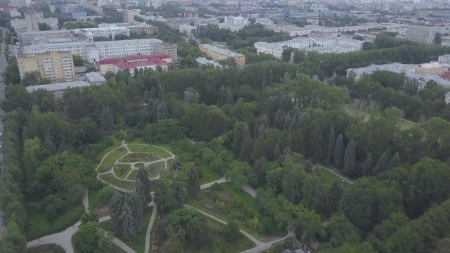Aerial view, beautiful city park landscape. Green city park. Beautiful nature in the middle of the city. Cityscape with Meadow and The Lake in Park at summer day aerial view