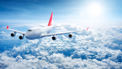 Airplane flying above clouds