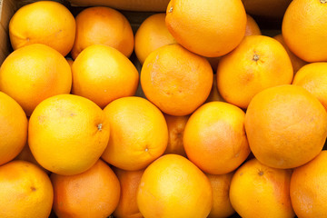 Ripe orange fruit oranges background oranges in a shop window selling oranges
