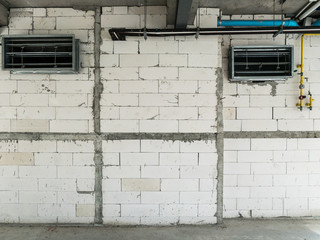 industrial white brick wall with grout,electric wire ,aluminum window and system pipe