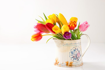 Bouquet of tulips in a vase. Selective focus.  Copy space