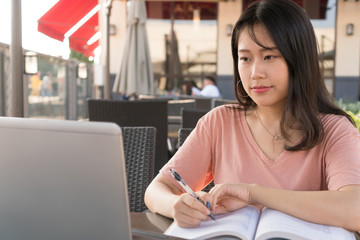 asian girl is studying