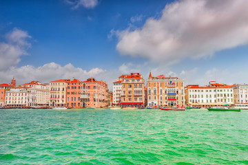 Views of the most beautiful canal of Venice - Grand Canal water streets, boats, gondolas, mansions along. Italy.