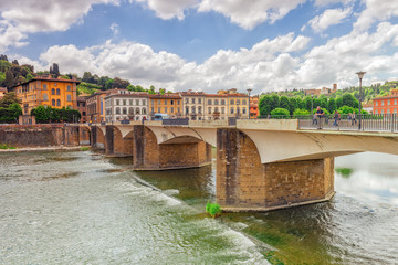 Beautiful landscape view bank of the Arno River of the Florence - Bridge to Thanksgiving (Ponte alle Grazie). Italy.