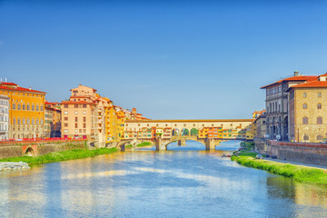 Obraz premium Ponte Vecchio is a bridge in Florence, located at the narrowest point of the Arno River, almost opposite the Uffizi Gallery.Italy.