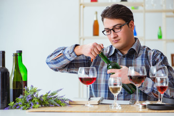 Professional sommelier tasting red wine 