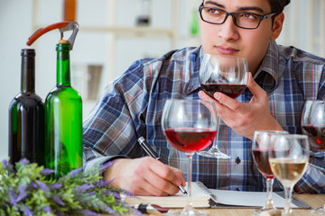 Professional sommelier tasting red wine 