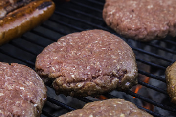 Hamburger patties on the grill.