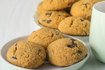 Healthy Coconut Flour Cookies with Chocolate Chunks on Plate with Cup
