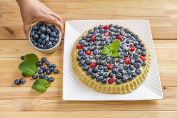 Dessert berry cake blueberry tart with fresh berries and pastry cream